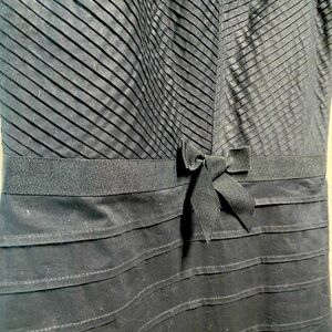 Black cotton strapless dress.